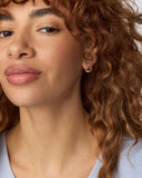 CAILIN CRYSTAL HUGGIE EARRINGS GOLD PURPLE CRYSTAL
